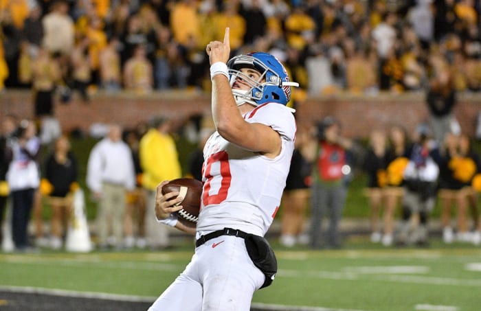 Mississippi Rebels quarterback John Rhys Plumlee (10) celebrates after scoring during the second half against the Missouri Tigers at Memorial Stadium/Faurot Field. Mandatory Credit: Denny Medley-USA TODAY Sports